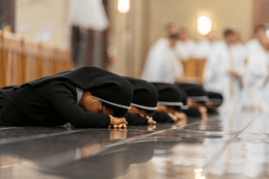 Why do nuns lay on the floor when taking vows? - Christian Faith Guide